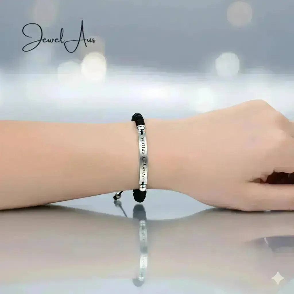 Bracelet on a wrist with a blurred background, featuring the brand 'Jewel A'.