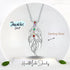 Silver necklace with colorful stones on a white background, featuring 'JewelAus Spirit' branding.